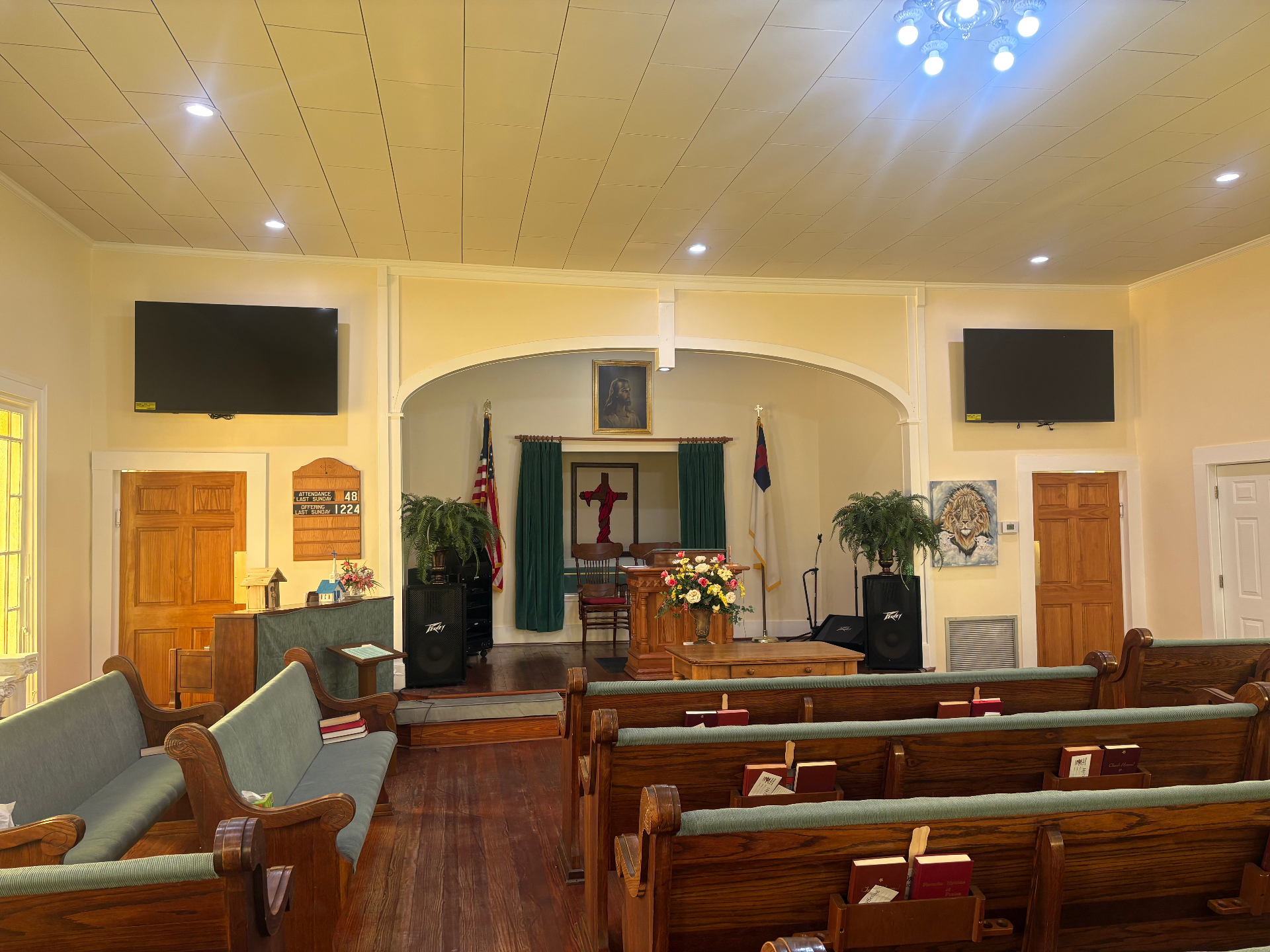 Inside the Lake Park Christian Church sanctuary showing pulpit and both screens